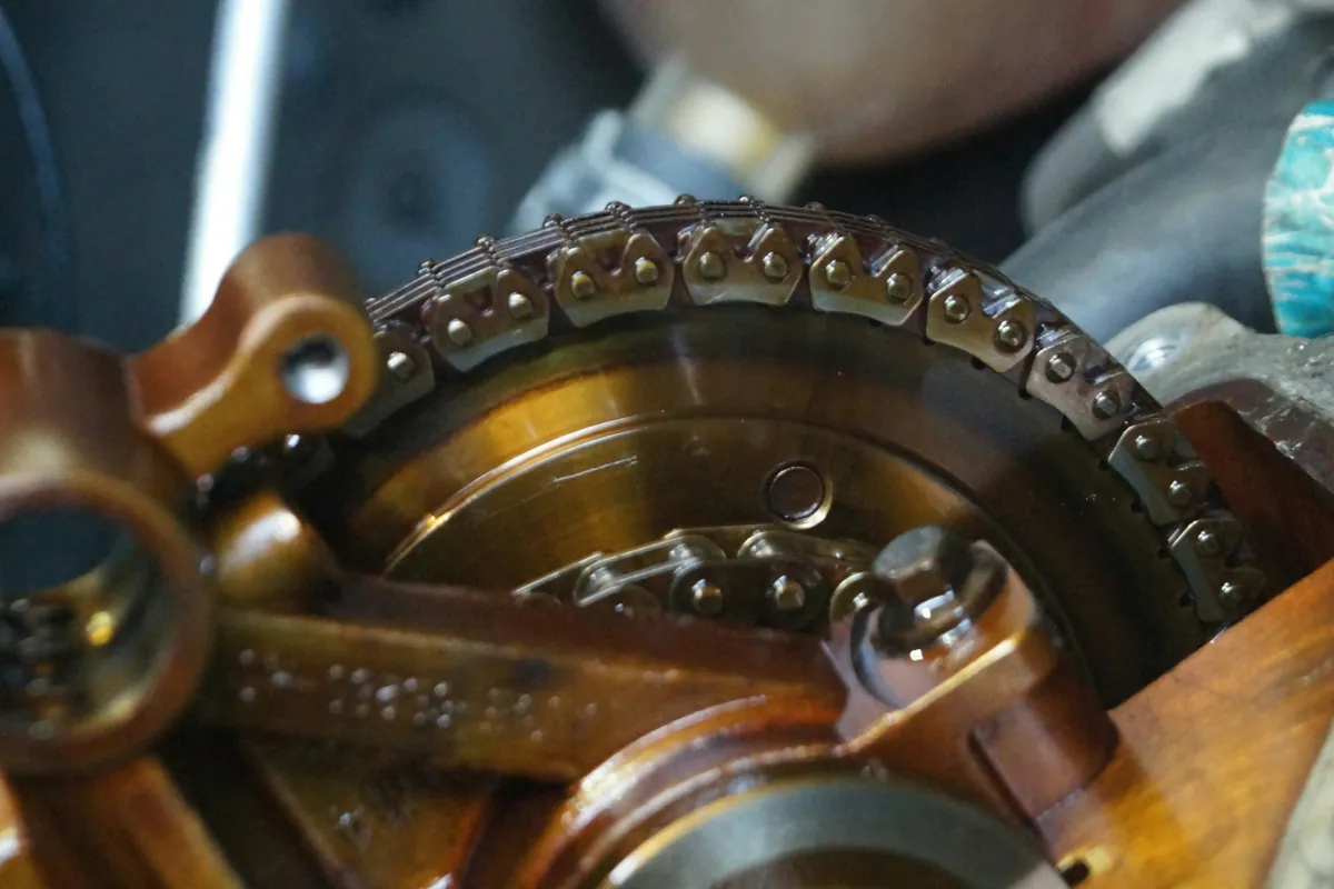 Close-up of an oiled chain and sprocket